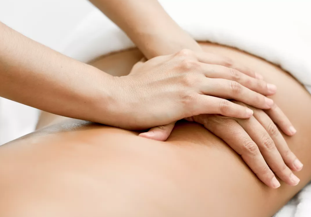 Lady giving full body remedial massage