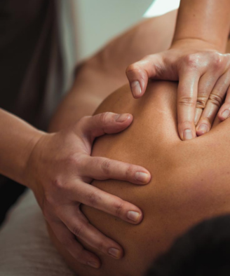 Customer receiving a therapeutic massage from a massage therapist in Ripley